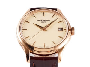 Calatrava Rose Gold watch with 39mm ivory dial, date display at 3 o'clock, brown leather strap. Elegant and timeless design.
