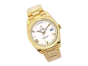 Day-Date 40 Yellow Gold ‘President’ with white dial, Roman numerals, fluted bezel, and gold bracelet displayed.