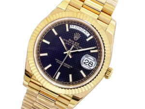 Day-Date 40 Yellow Gold ‘President’ watch with a black motif dial, fluted bezel, and day-date display on the product page.