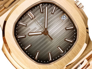 Nautilus Rose Gold (40mm) with Chocolate Dial, gold hour markers, date display at 3 o'clock, and sleek striped detailing.