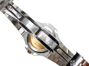 Close-up of the Nautilus Stainless Steel watch (40mm) showcasing its clasp, bracelet details, and engraved logo on the back.