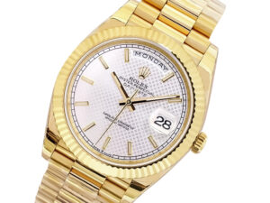 Day-Date 40 Yellow Gold ‘President’ watch with silver motif dial, fluted bezel, day display at 12 o’clock, date at 3 o’clock.