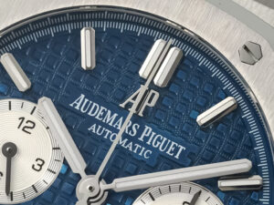 Close-up of the Royal Oak Chronograph Stainless Steel watch with a blue "Grande Tapisserie" dial and silver-tone markers.