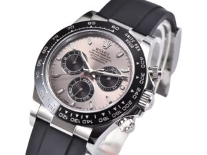 Cosmograph Daytona Stainless Steel with Oysterflex strap, grey sunburst dial, and black ceramic bezel displayed at an angle.