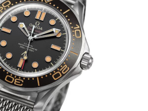 Close-up of the Seamaster Diver 300 Titanium ‘No Time to Die’ (42mm) featuring a black dial and vintage-inspired markers.
