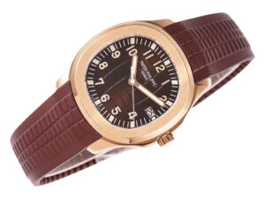 Aquanaut Rose Gold with Chocolate Dial (40mm) featuring a brown rubber strap, white numerals, and date display at 3 o'clock.