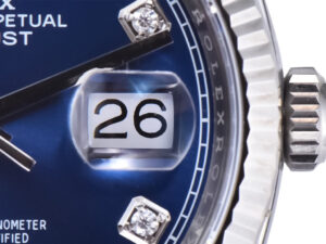 Close-up of the Datejust 36 Stainless Steel watch featuring a Jubilee bracelet, diamond blue dial, fluted bezel, date window.