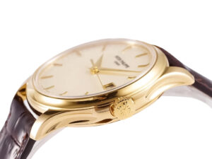 Calatrava Yellow Gold watch with an ivory dial and 39mm case, shown in side view highlighting its elegant gold details.