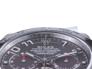Close-up of the Cosmograph Daytona Stainless Steel watch with grey sunburst dial, Arabic numerals, and chronograph sub-dials.