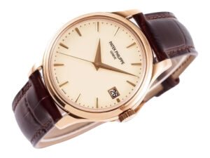 Calatrava Rose Gold watch with ivory dial, 39mm case, brown leather strap, and date display at the 3 o'clock position.