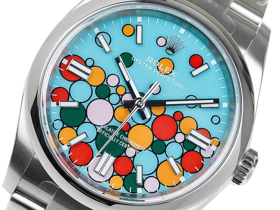 Oyster Perpetual 36 stainless steel watch with turquoise dial featuring a colorful celebration motif of overlapping circles.