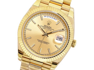 Day-Date 40 Yellow Gold ‘President’ watch with Champagne Dial, Fluted Bezel, and day-date display at 12 and 3 o’clock.