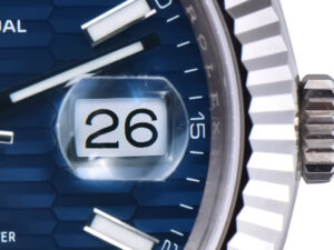 Close-up of the Datejust 41 Stainless Steel watch fluted motif blue dial, magnified date display, fluted bezel on Jubilee.