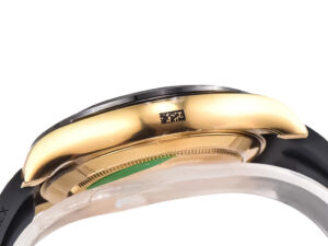 Side view of the Cosmograph Daytona Yellow Gold Oysterflex with Black and Champagne Dial showing its gold bezel edge.