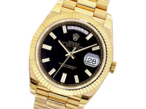 Day-Date 40 Yellow Gold ‘President’ watch with Onyx Diamond Dial, Fluted Bezel, day display, and gold bracelet.
