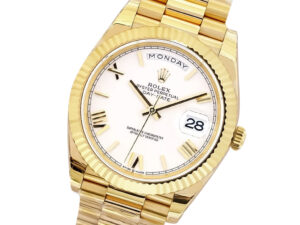 Day-Date 40 Yellow Gold 'President' watch with white Roman numeral dial, fluted bezel, and gold bracelet.