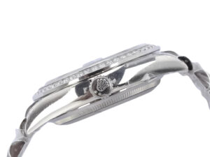 Side view of the Day-Date 36 Stainless Steel ‘President’ watch with diamond bezel and crown emblem on the side.