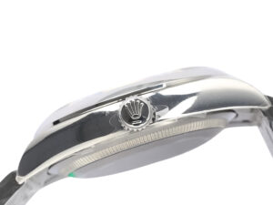Side view of the Oyster Perpetual 36 Stainless Steel watch showcasing its polished finish and branded crown with emblem.