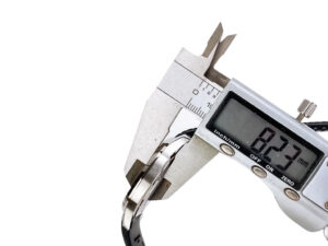 Digital caliper measuring the thickness of the Aquanaut Stainless Steel with Black Dial (40mm) at 8.27 mm.