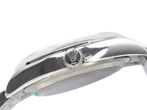Side view of the Oyster Perpetual 36 Stainless Steel watch, showcasing the crown logo on the winding crown, polished finish.