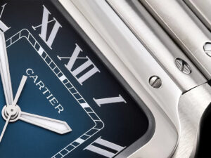 Close-up of Santos Large Stainless Steel watch with blue dial, Roman numerals, stainless steel case, and polished details.
