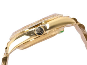 Side view of the Day-Date 36 Yellow Gold ‘President’ watch showing its diamond bezel, crown detail, and polished finish.