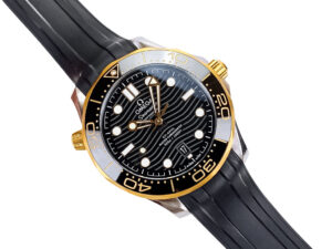 Seamaster Diver 300 watch with black dial, gold bezel, stainless steel case, and black rubber strap (42mm).