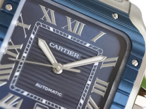 Close-up of Santos Large Stainless Steel Watch with Blue Dial, Roman numerals, Blue Bezel, and Silver-Tone Hands (40mm).