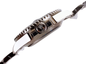 Side view of the Submariner Date Stainless Steel watch (40mm) showing the crown with Rolex logo and detailed bezel design.