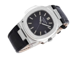 Nautilus stainless steel watch with grey dial, 40mm case, and black leather strap displayed at an angle.