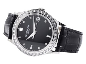 Calatrava Stainless Steel watch with Diamond Black Dial, Diamond Bezel (38mm), and black leather strap displayed at an angle.