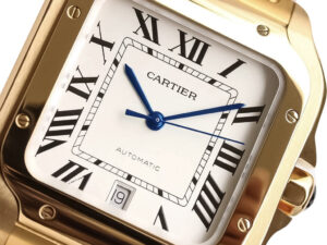 Close-up view of the Santos Large Yellow Gold with White Dial (40mm) featuring Roman numerals, blue hands, and date display.