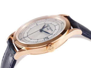 Calatrava Rose Gold ‘Scientific’ watch with a silver dial (38mm) and blue leather strap, featuring elegant craftsmanship.
