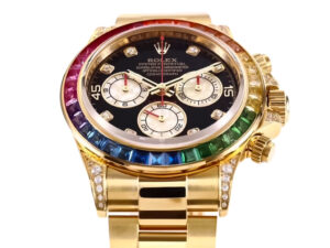 Cosmograph Daytona Yellow Gold ‘Rainbow’ watch with diamond bezel, black dial, and multicolored gemstone accents.