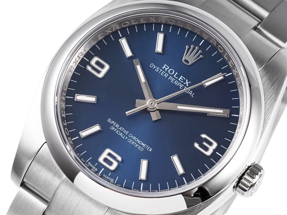 Oyster Perpetual 36 Stainless Steel watch with blue dial, Arabic numerals, and silver-tone hour markers displayed up close.