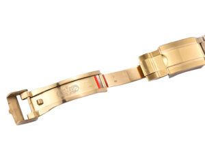 Gold clasp of the Cosmograph Daytona Yellow Gold ‘John Mayer’ with Green Dial, showcasing intricate craftsmanship.