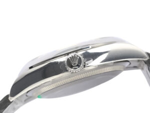Side view of the Oyster Perpetual 36 Stainless Steel watch showing the crown and polished case details.