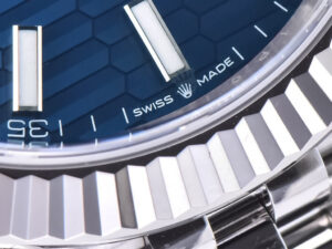 Close-up of the Datejust 41 Stainless Steel on Jubilee with Fluted Motif Blue Dial and Fluted Bezel, "Swiss Made."