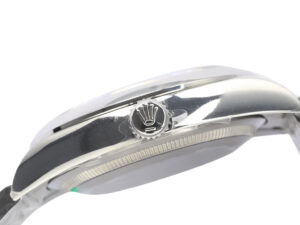 Side view of the Oyster Perpetual 36 Stainless Steel watch showcasing the crown and polished finish.