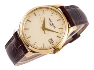 Calatrava Yellow Gold watch with an ivory dial (39mm), featuring a brown leather strap and minimalist date display.
