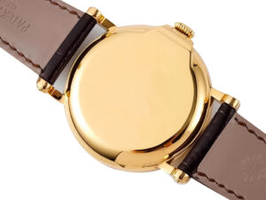 Back view of the Calatrava Yellow Gold watch, showcasing its polished case and brown leather strap details.
