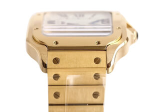 Close-up of the Santos Large Yellow Gold with White Dial (40mm) showcasing its gold case, bracelet, and screws in detail.