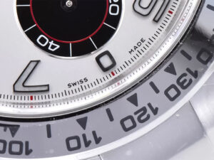 Close-up of the Cosmograph Daytona Stainless Steel watch face featuring a white dial, Arabic numerals, "SWISS MADE" marking.