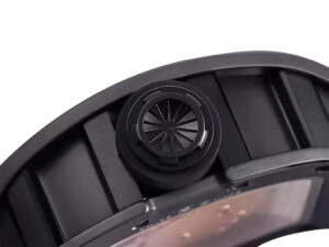 Side view of RM 52-01 watch crown, showcasing its detailed black design on the black rubber strap and bezel.