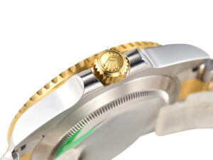Side view of Submariner Date 'Two Tone' Yellow Gold and Stainless Steel watch, showcasing the gold crown and case detailing.