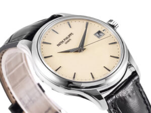 Calatrava Stainless Steel watch with ivory dial (39mm), black leather strap, date window, and sleek minimalist design.