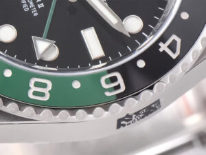 Close-up of the GMT-Master II Stainless Steel 'Sprite' on Jubilee featuring a green and black bezel with luminescent markers.