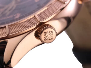 Close-up of the crown and textured rose gold casing of the Celestial Only Watch with black dial, fine craftsmanship.