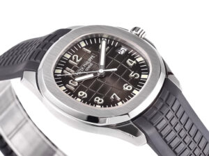 Aquanaut Stainless Steel watch with black dial (38mm) featuring a bold grid pattern and matching textured black rubber strap.