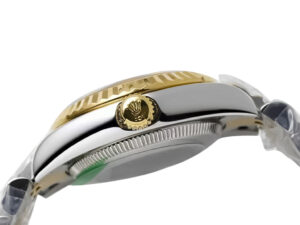 Side view of the Lady-Datejust 28 Two Tone Yellow Gold on Jubilee bracelet, showcasing the fluted bezel crown emblem details.